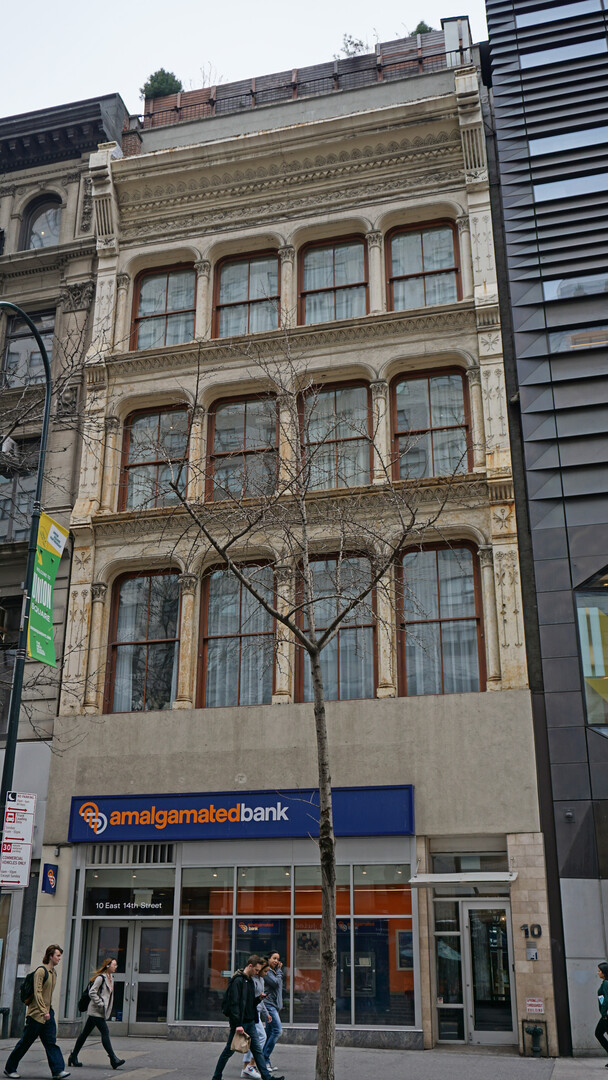 This beautifully intact cast-iron structure which dates to 1880 was later owned by W. Jennings Demorest. In 1891 this structure was extended through the block with the construction of a connecting structure at 5 East 13th Street. Four bays in width, the cast iron façade at the upper stories features large rectilinear windows with rounded corners and eclectic ornament. 
The top story, which is set back from the façade, was added in the early 2000s.
Click here to send a letter supporting landmark designation of this and other historic buildings south of Union Square.
.
.
.

